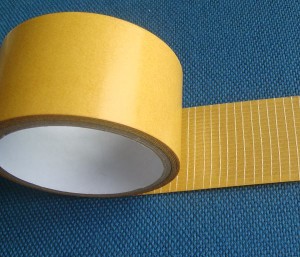 Adhesive double-sided tapes on carrier of glass fibre net - 2703